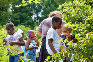 Children playing in a garden and enjoying outdoor activities